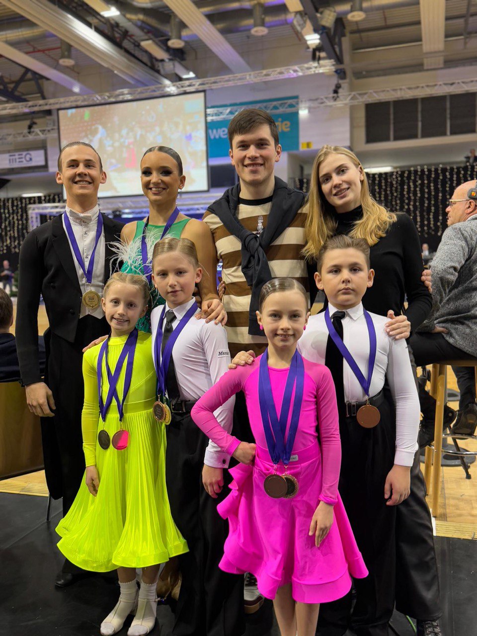 Our team of dancers proudly wearing competition medals