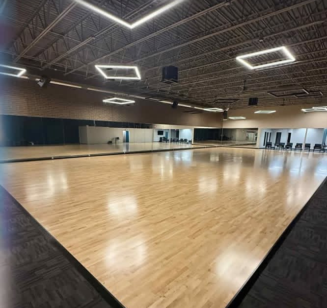 Our spacious wood-floored ballroom dance studio